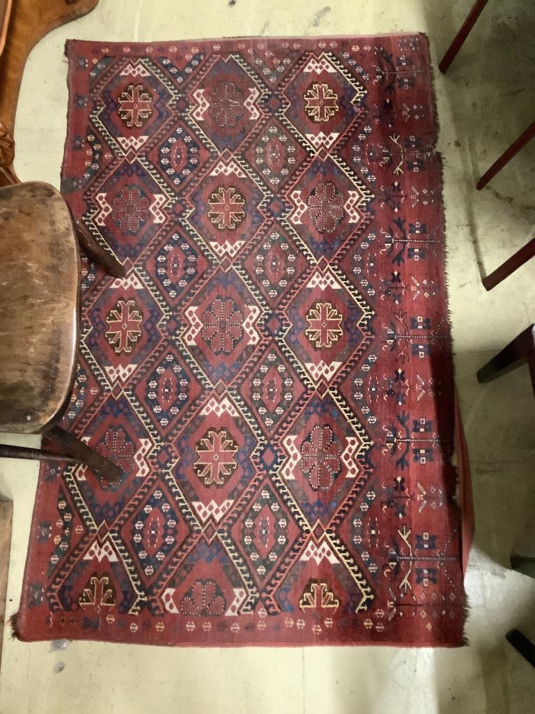 A pair of Caucasian red ground rugs, 154 x 97cm